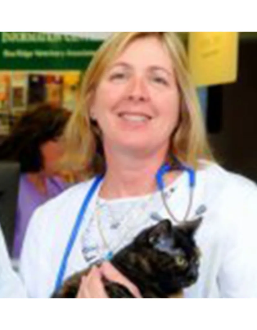 Dr. Nancy Hall holding a black cat
